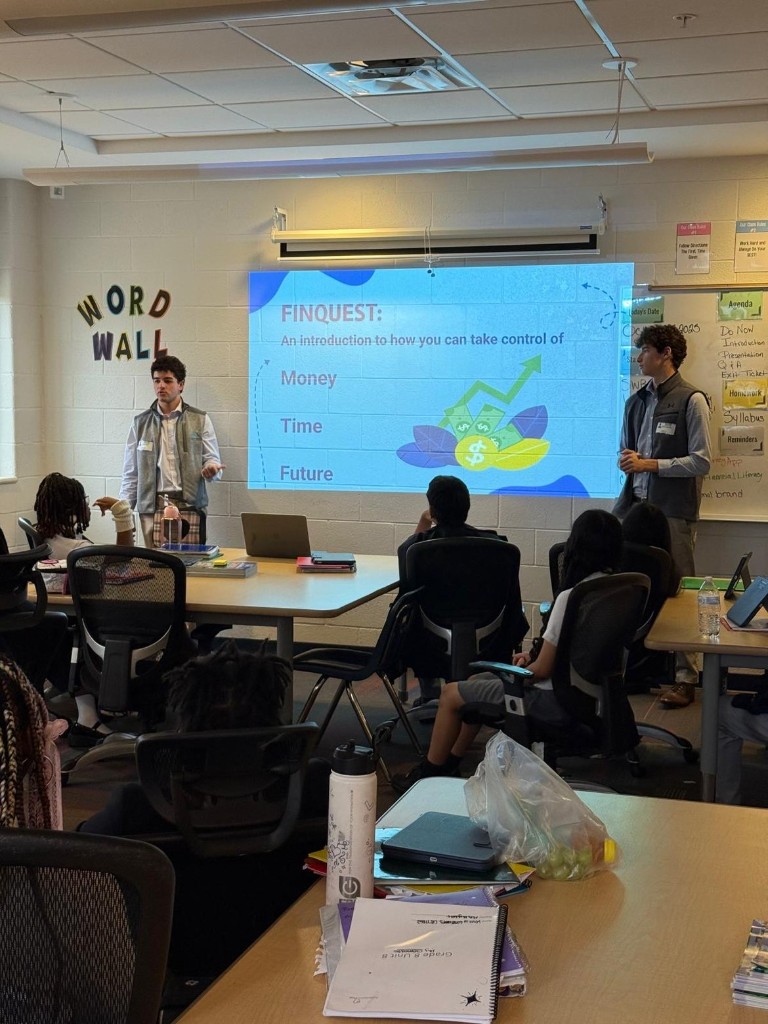 Finquest team presenting in the classroom